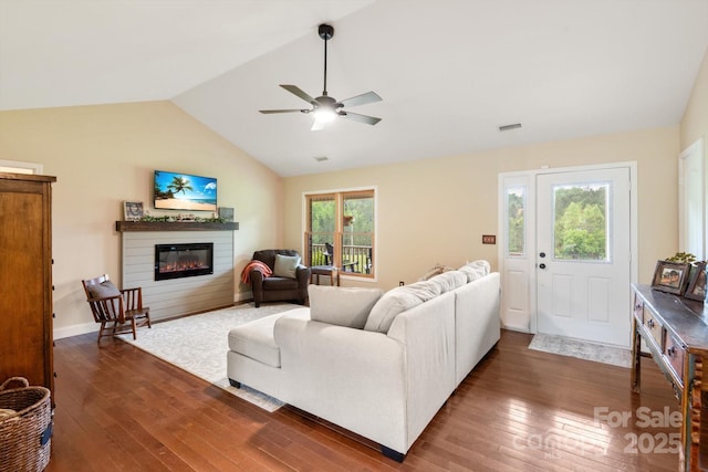 1091 Bill Collins Rd, Columbus, NC 28722 - living room featuring wood-type flooring, a glass covered fireplace, lofted ceiling, and a ceiling fan