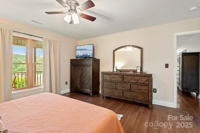 1091 Bill Collins Rd, Columbus, NC 28722 - bedroom featuring baseboards, dark wood-style flooring, and a ceiling fan