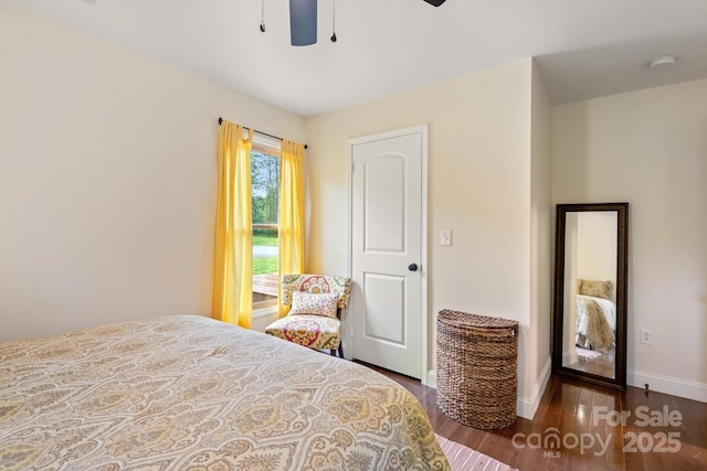 1091 Bill Collins Rd, Columbus, NC 28722 - bedroom with wood finished floors, baseboards, and ceiling fan