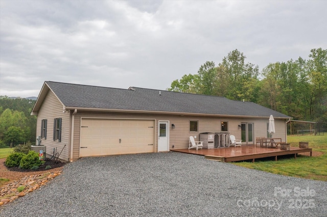 1091 Bill Collins Rd, Columbus, NC 28722 - back of house featuring a wooden deck, a garage, driveway, and central AC unit