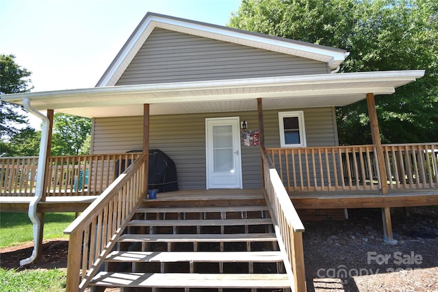 exterior space featuring a porch and stairway