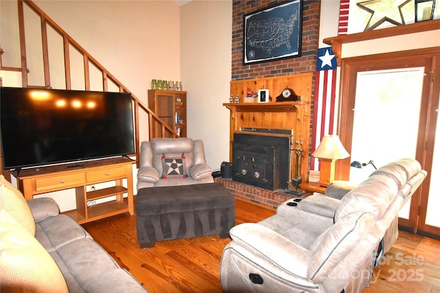 living area featuring a fireplace and wood finished floors