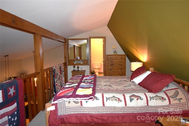 bedroom with connected bathroom and vaulted ceiling