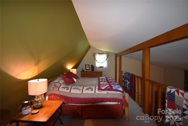 carpeted bedroom with vaulted ceiling