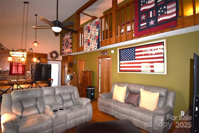 5769 Birch St, Conover, NC 28613 - living area featuring a ceiling fan, a high ceiling, and wood finished floors