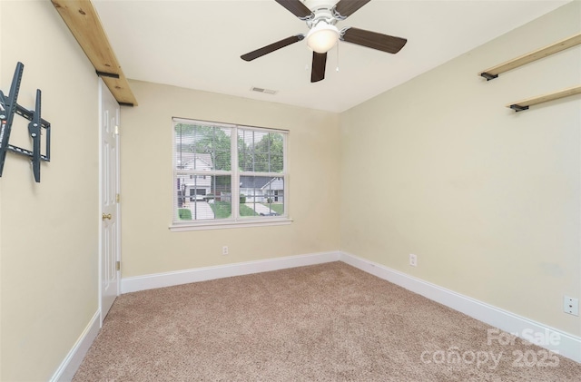 spare room featuring ceiling fan, baseboards, carpet flooring, and visible vents