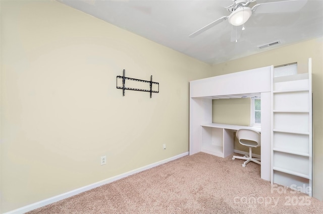 unfurnished bedroom with carpet floors, visible vents, baseboards, and ceiling fan