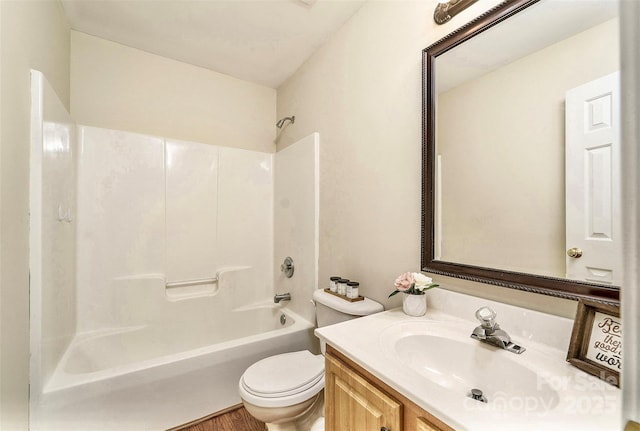 full bathroom featuring bathtub / shower combination, vanity, and toilet