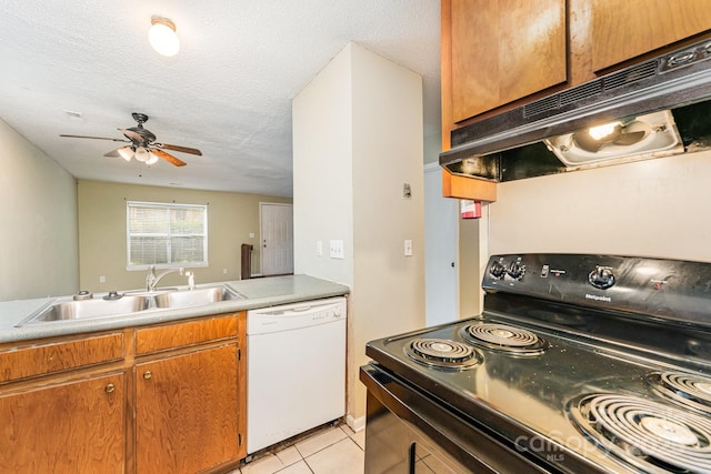 kitchen with light tile patterned floors, under cabinet range hood, a sink, white dishwasher, and black range with electric stovetop