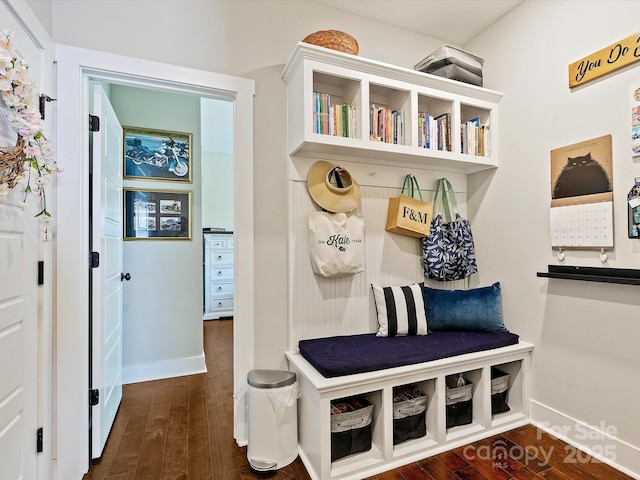 mudroom featuring dark wood-style floors and baseboards