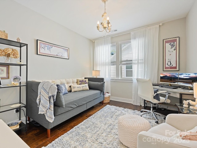 home office with dark wood finished floors, baseboards, and a notable chandelier