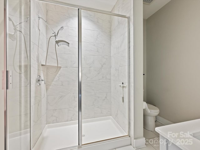 full bathroom with toilet and a stall shower