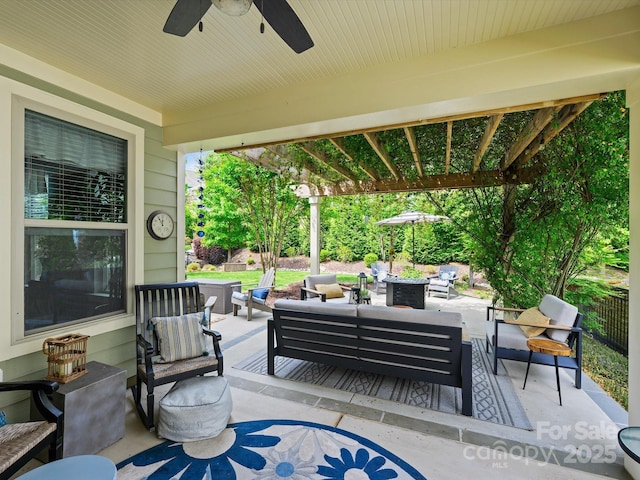 view of patio featuring an outdoor living space and ceiling fan