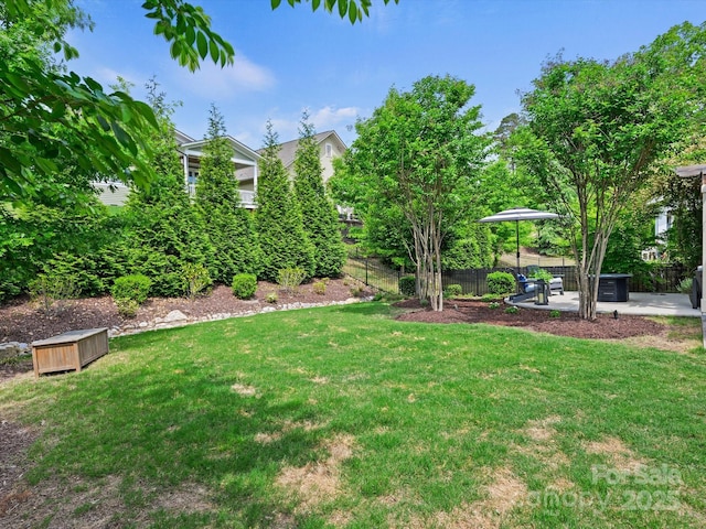 view of yard with fence and a patio area