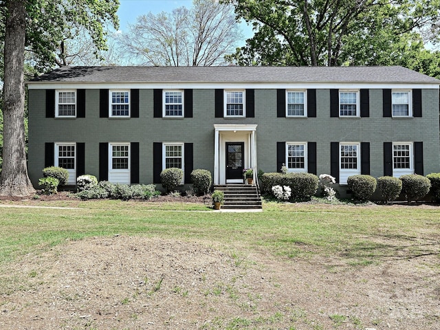 557 Wakefield Dr Unit A, Charlotte, NC 28209 - colonial-style house featuring a front lawn and brick siding