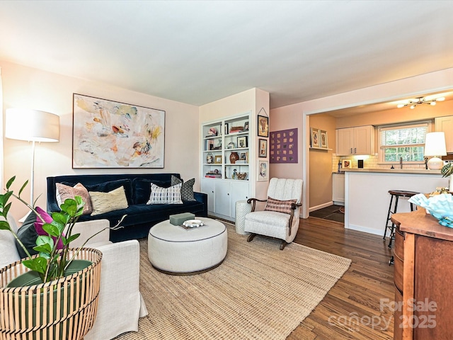 557 Wakefield Dr Unit A, Charlotte, NC 28209 - living area featuring dark wood-type flooring and a chandelier