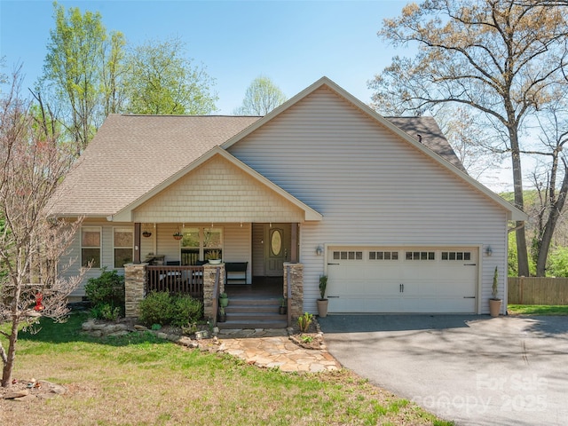 18 Birdsong Ln, Candler, NC 28715 - craftsman house with an attached garage, covered porch, and driveway