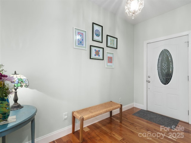 18 Birdsong Ln, Candler, NC 28715 - entryway with wood finished floors, baseboards, and a notable chandelier