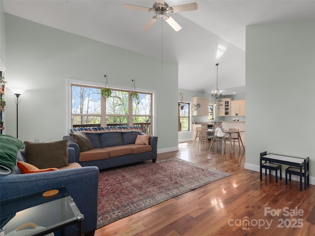 18 Birdsong Ln, Candler, NC 28715 - living area featuring wood finished floors, high vaulted ceiling, and plenty of natural light