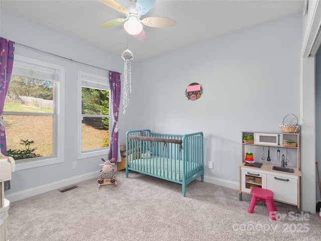 18 Birdsong Ln, Candler, NC 28715 - carpeted bedroom with ceiling fan, baseboards, visible vents, and a crib