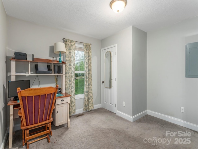 home office with a textured ceiling, visible vents, electric panel, carpet flooring, and baseboards