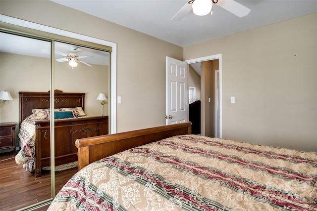 bedroom with a closet, wood finished floors, and a ceiling fan