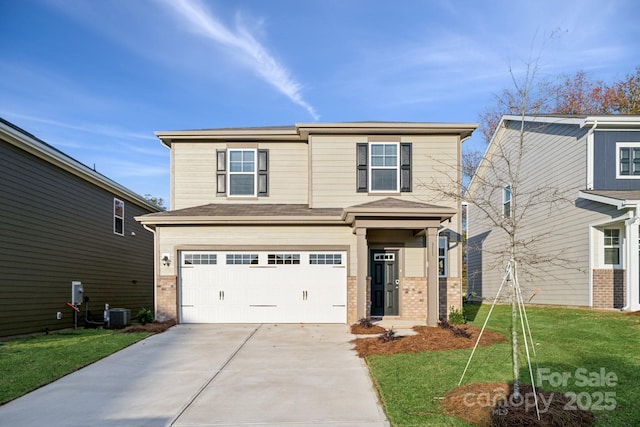 traditional-style house with brick siding, an attached garage, driveway, and a front lawn