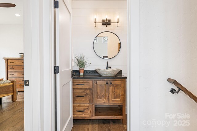 bathroom featuring vanity and wood finished floors