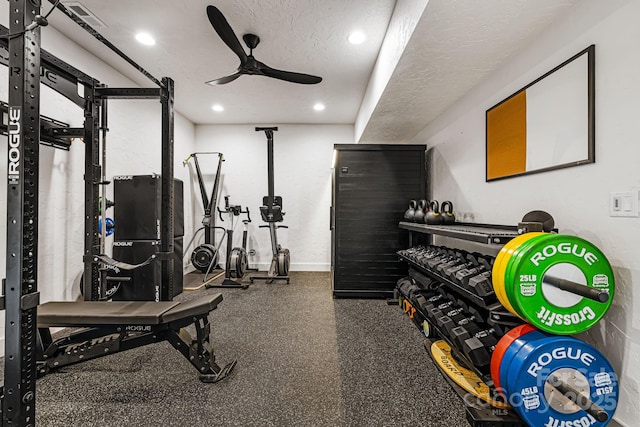 workout room with a textured ceiling, baseboards, a ceiling fan, and recessed lighting