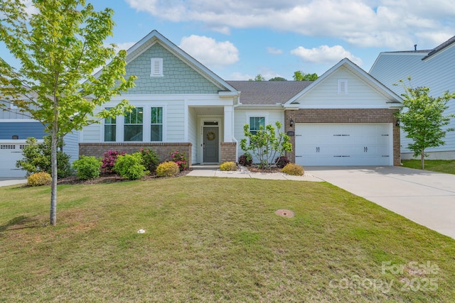 craftsman house with driveway, a front lawn, an attached garage, and brick siding