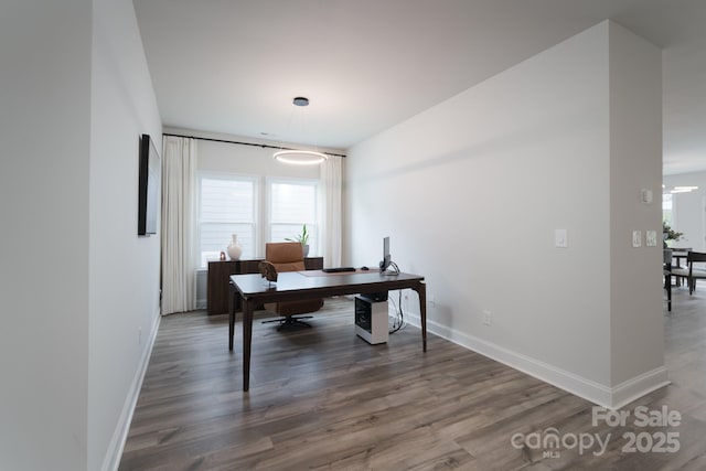 office space featuring wood finished floors and baseboards