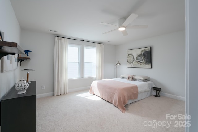 bedroom with carpet, visible vents, ceiling fan, and baseboards