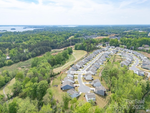 bird's eye view featuring a residential view and a view of trees