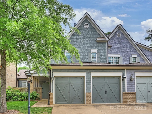 2616 Colton Dr, Charlotte, NC 28211 - townhome / multi-family property featuring concrete driveway, brick siding, and an attached garage