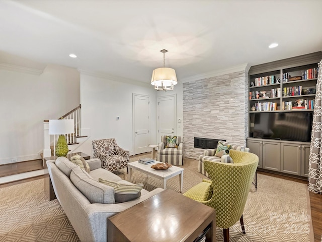 2616 Colton Dr, Charlotte, NC 28211 - living room featuring recessed lighting, a fireplace, stairway, crown molding, and wood finished floors