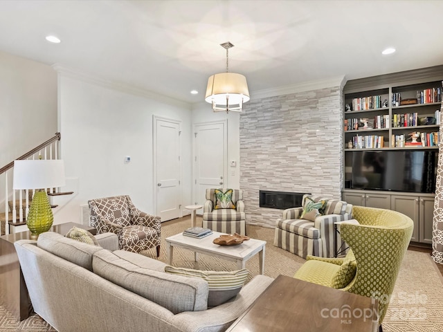 2616 Colton Dr, Charlotte, NC 28211 - living area featuring ornamental molding, recessed lighting, and a fireplace