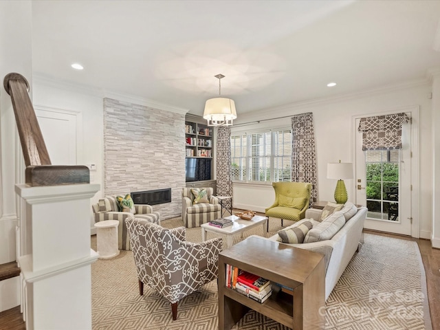 2616 Colton Dr, Charlotte, NC 28211 - living room with ornamental molding, recessed lighting, wood finished floors, and a fireplace