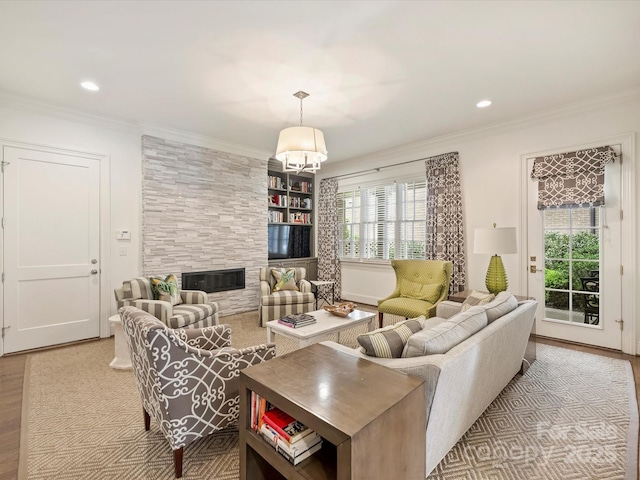 2616 Colton Dr, Charlotte, NC 28211 - living room with crown molding, a tile fireplace, wood finished floors, and recessed lighting