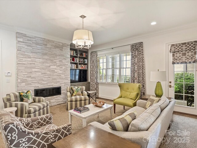 2616 Colton Dr, Charlotte, NC 28211 - living area with an inviting chandelier, a tile fireplace, and ornamental molding