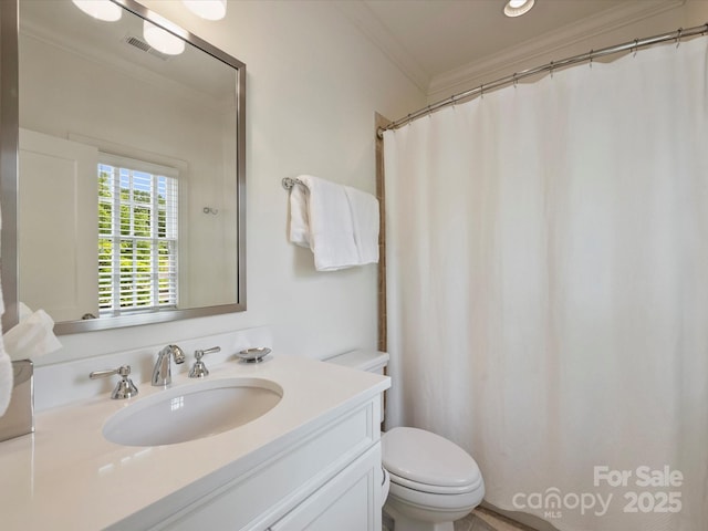 2616 Colton Dr, Charlotte, NC 28211 - bathroom with ornamental molding, toilet, vanity, and visible vents