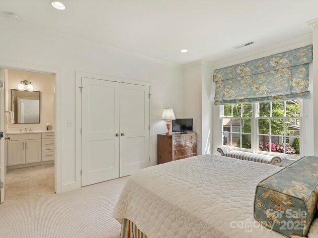 2616 Colton Dr, Charlotte, NC 28211 - bedroom with a closet, ornamental molding, recessed lighting, visible vents, and a sink