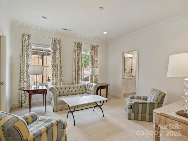 2616 Colton Dr, Charlotte, NC 28211 - living area featuring visible vents, baseboards, ornamental molding, recessed lighting, and light colored carpet