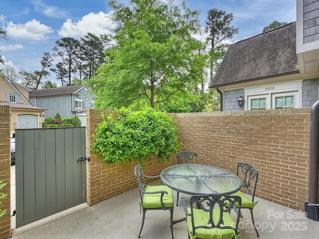 2616 Colton Dr, Charlotte, NC 28211 - view of patio / terrace featuring a gate, fence, and outdoor dining area