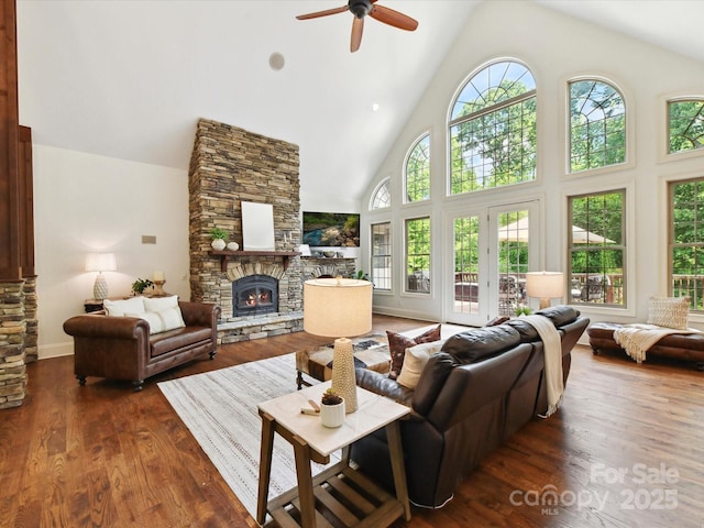 633 Elmhurst Dr, Fort Mill, SC 29715 - living area with a fireplace, high vaulted ceiling, a ceiling fan, wood finished floors, and baseboards