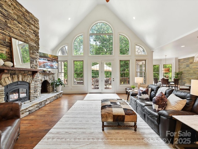 633 Elmhurst Dr, Fort Mill, SC 29715 - living area with high vaulted ceiling, a fireplace, and wood finished floors