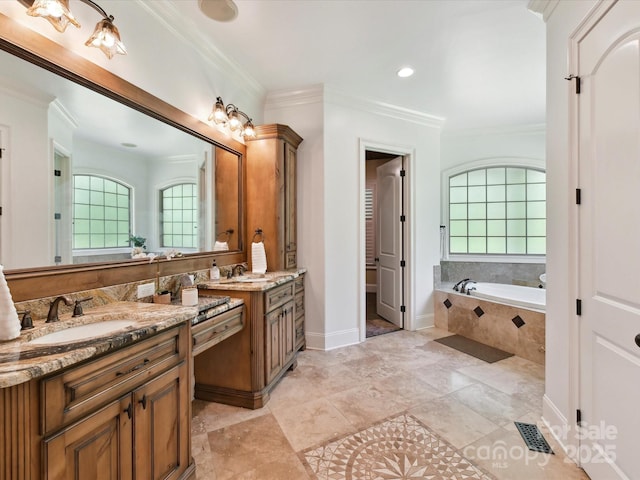 633 Elmhurst Dr, Fort Mill, SC 29715 - bathroom with vanity, a garden tub, crown molding, baseboards, and recessed lighting