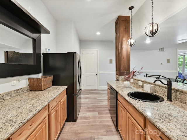 633 Elmhurst Dr, Fort Mill, SC 29715 - kitchen featuring a sink, freestanding refrigerator, black dishwasher, light wood-type flooring, and pendant lighting