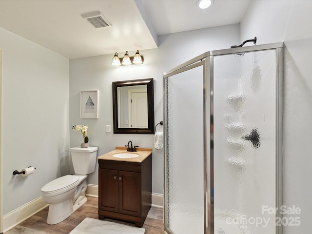 633 Elmhurst Dr, Fort Mill, SC 29715 - full bath featuring wood finished floors, a stall shower, vanity, toilet, and baseboards