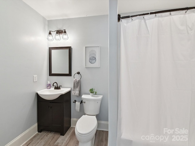 633 Elmhurst Dr, Fort Mill, SC 29715 - full bathroom featuring vanity, wood finished floors, toilet, and baseboards