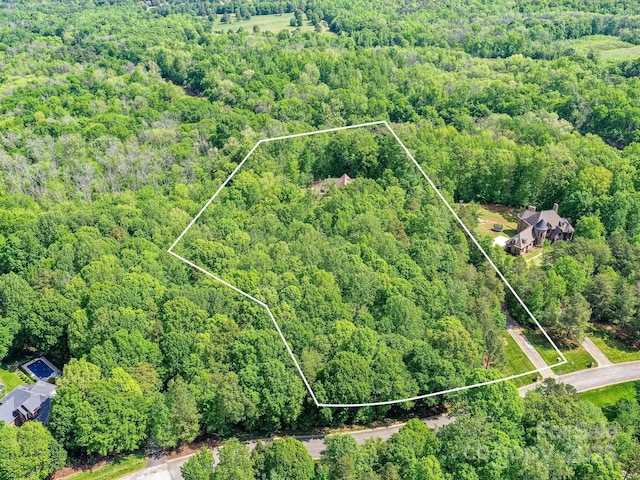 633 Elmhurst Dr, Fort Mill, SC 29715 - aerial view of property's location with a forest and property parcel outlined